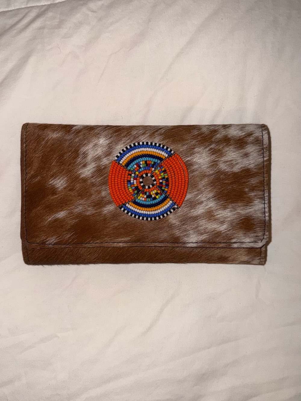 Hand-Tooled Brown Cowhide Clutch with Colorful Beaded Medallion